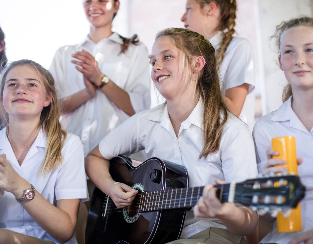 A group of new Grade 8 high school students playing music together