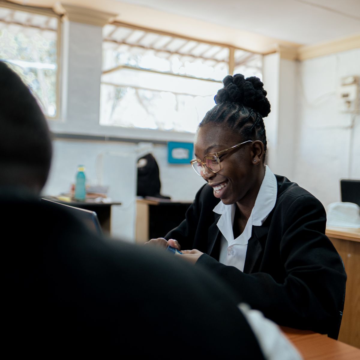 A student doing homework in a classroom setting