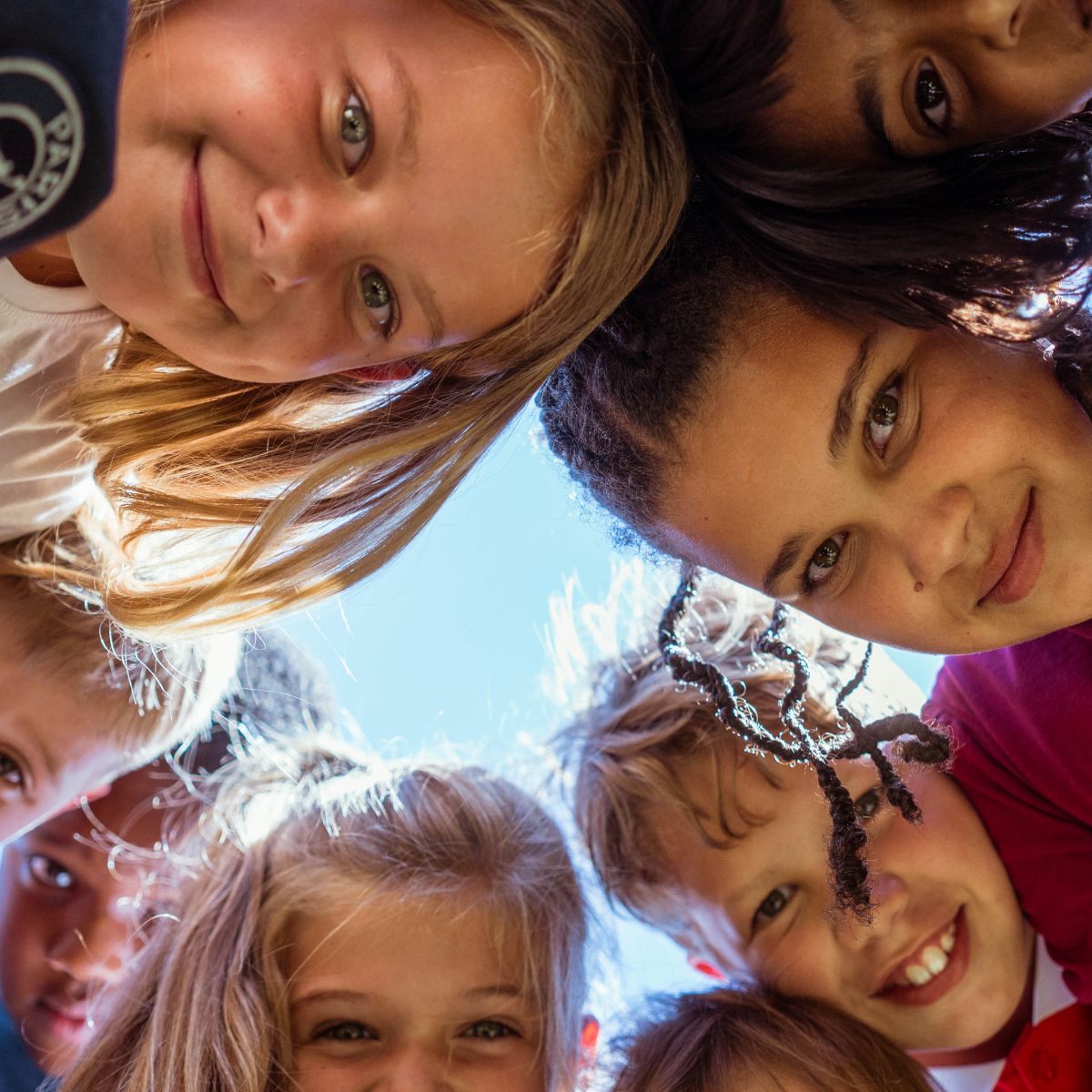 Children learning to improve their English by speaking together