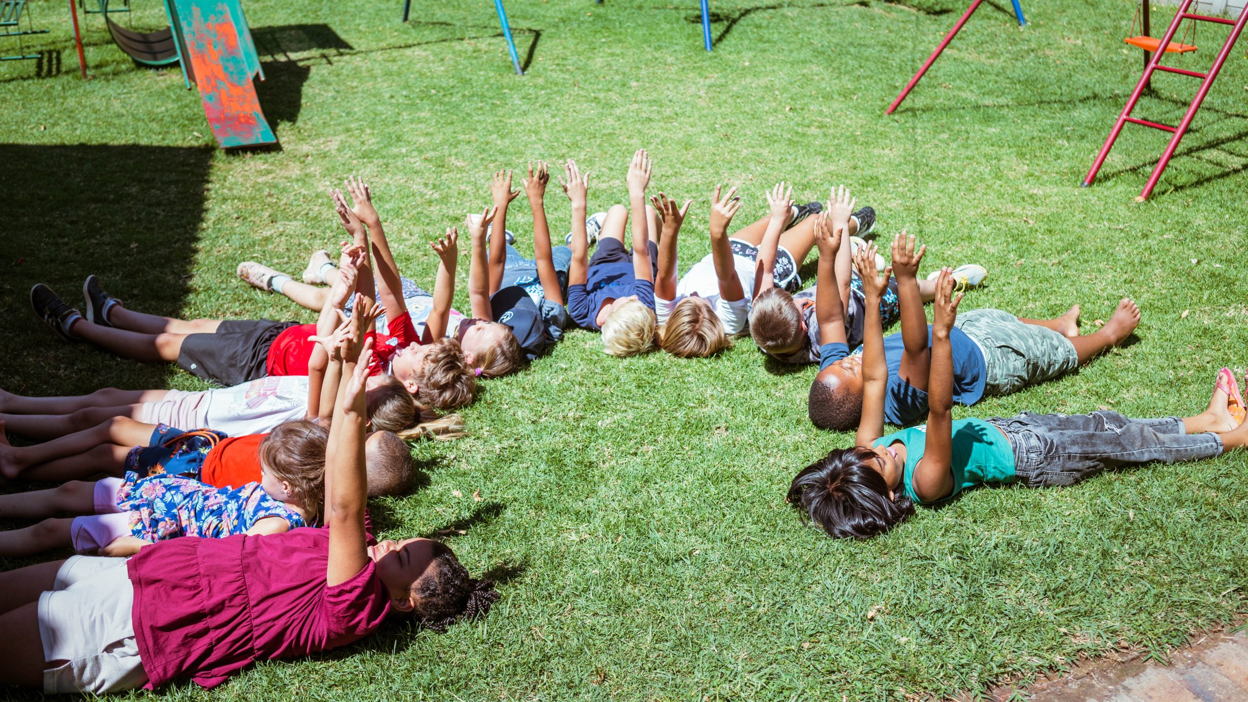 A South African learner focused on homework at a school desk