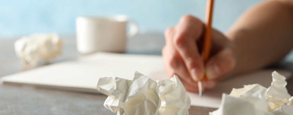 A learner reviewing common exam mistakes on a test paper