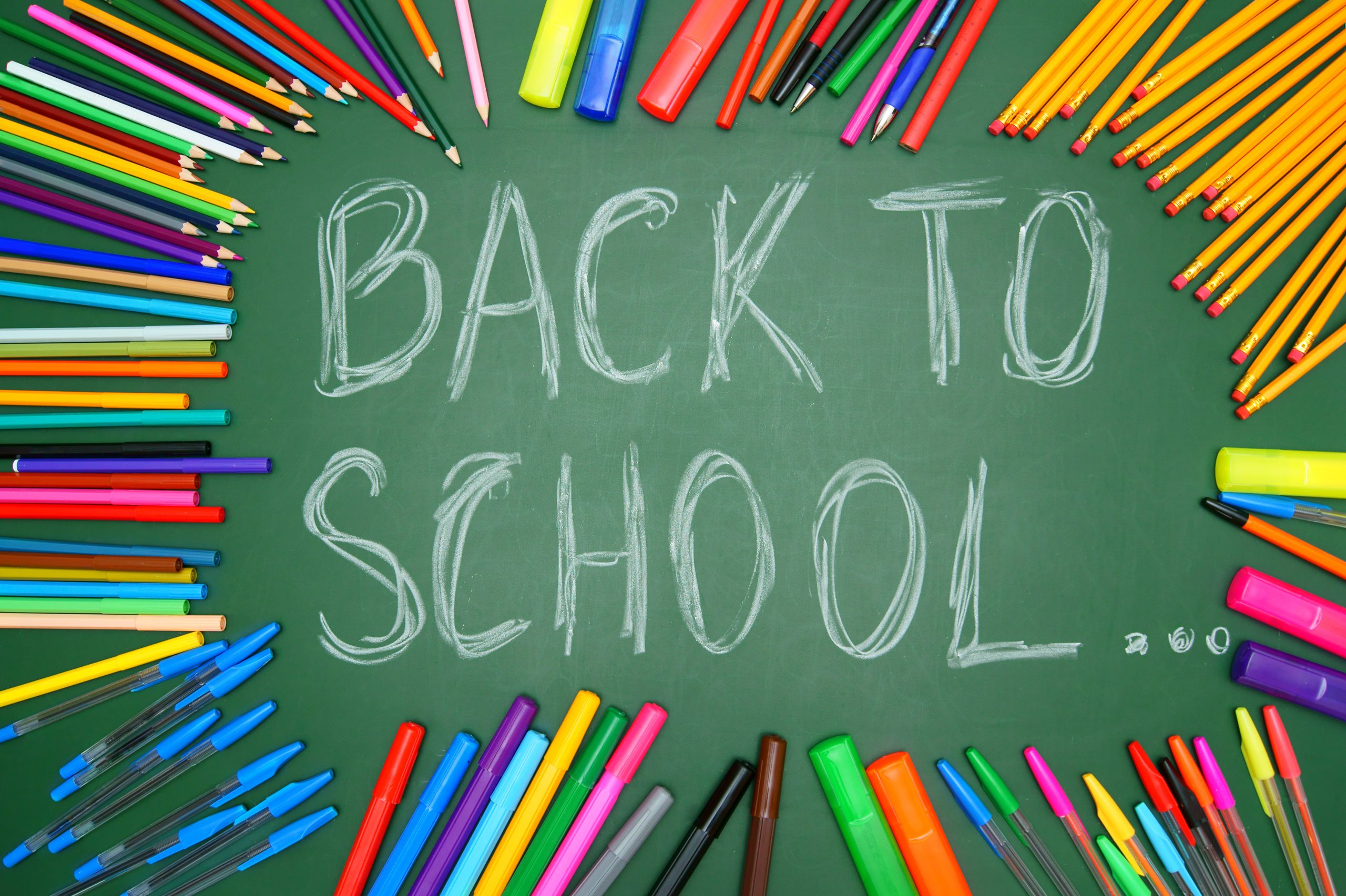 School supplies laid out for getting back into a school routine