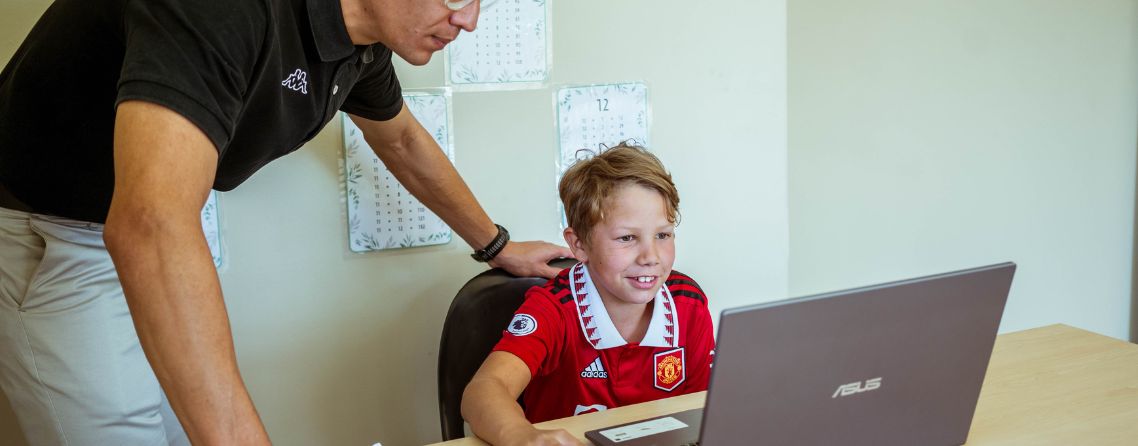 A child thinking independently while working on a school activity