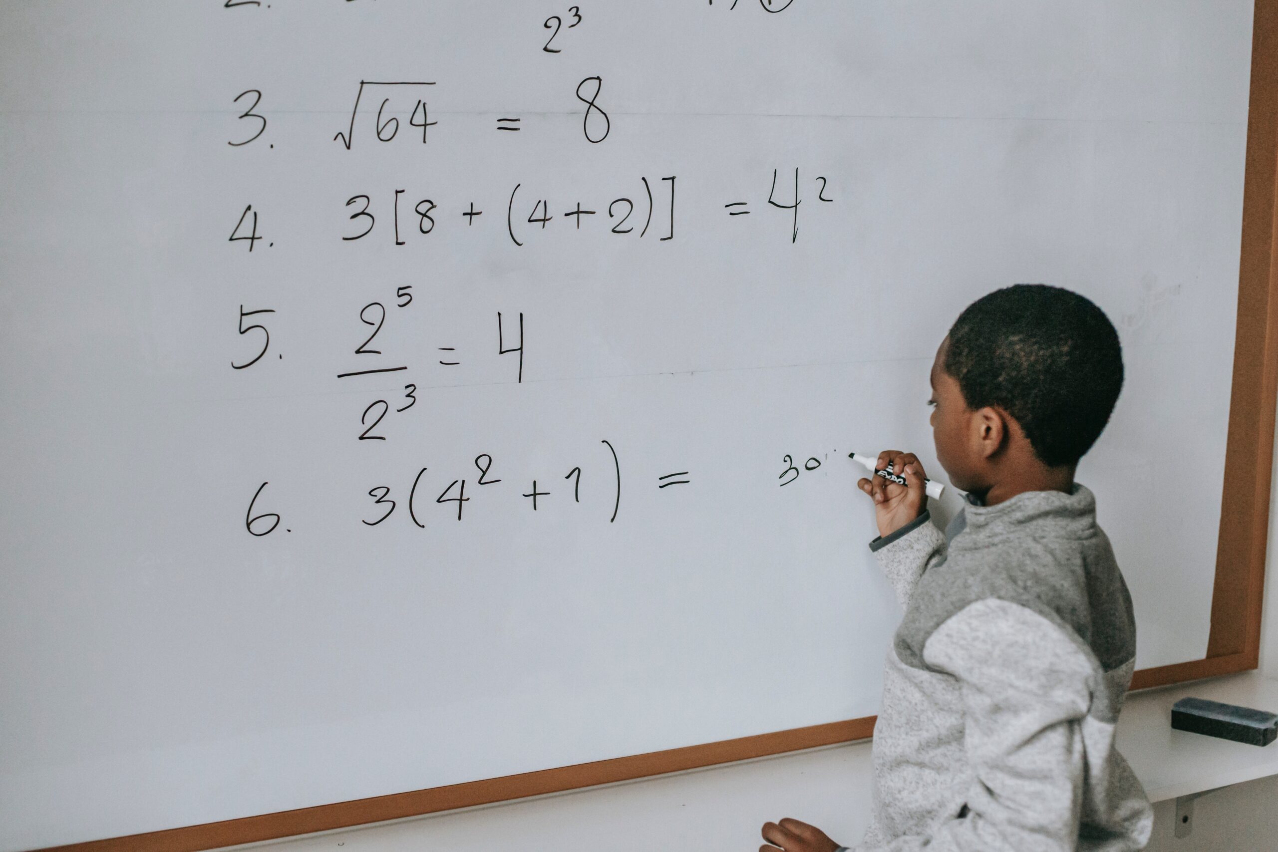 A young child learning early mathematics with colourful counting materials